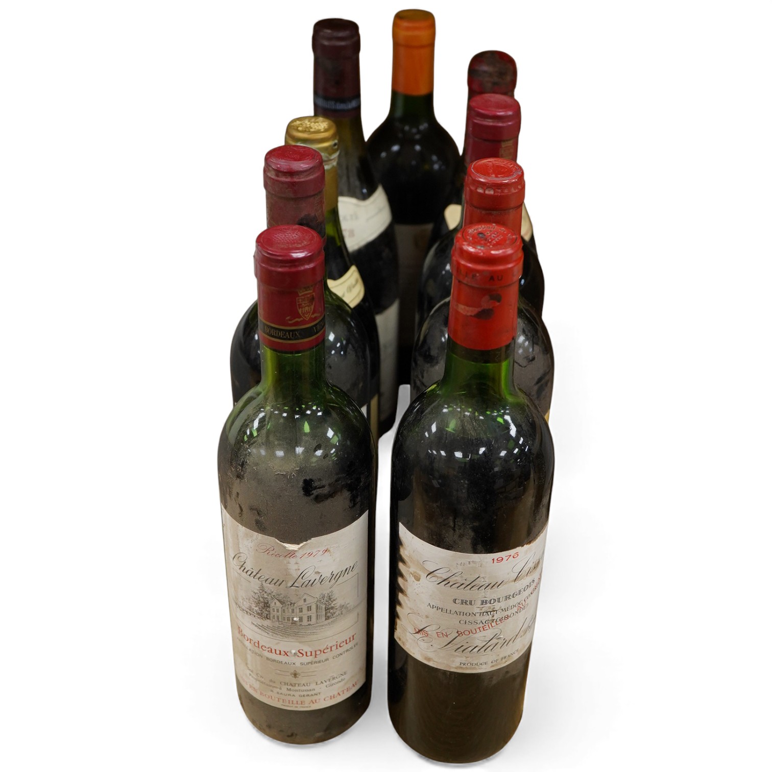Nine bottles of wine; three Chateau Lavergne Bordeaux Superieur 1979, Beaune 1974, Côtes du Rhône 1978, Beaujolais 1979, etc.